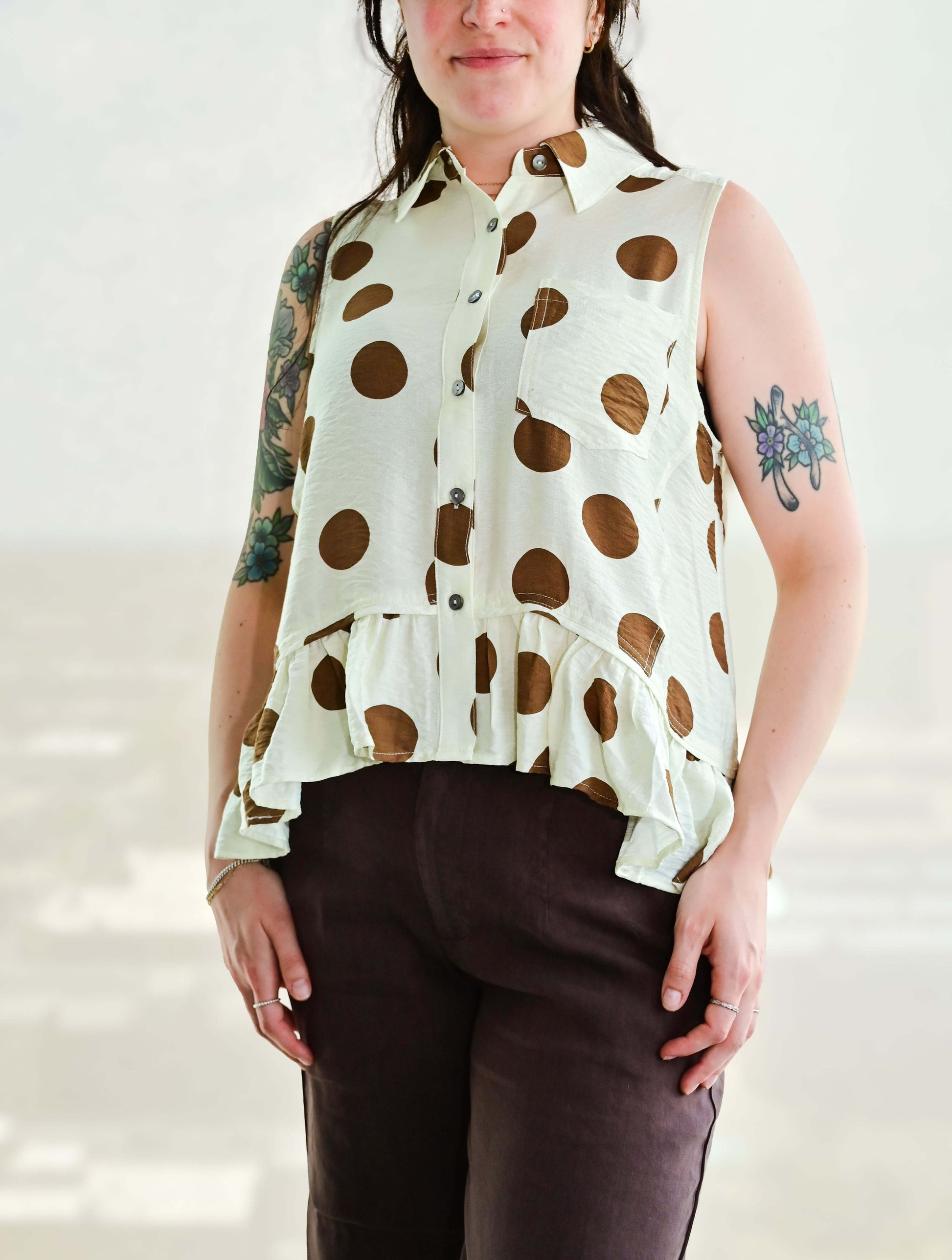 Polka Dot Sleeveless Button Up Blouse With Ruffle Hem